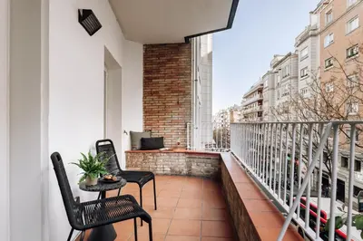 a bedroom with a large bed with a wooden headboard at Munia - 3 bedrooms and office in Sant Gervasi in Barcelona