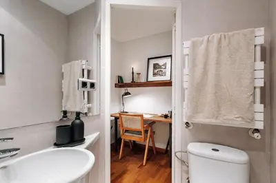 a kitchen with two stools and a shelf at Munia - 3 bedrooms and office in Sant Gervasi in Barcelona