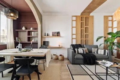 a kitchen with white cabinets and a sink and a stove at Kalo - 1 bedroom and office in Eixample Esquerra in Barcelona