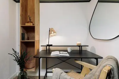 a dining room with a table and chairs at Kalo - 1 bedroom and office in Eixample Esquerra in Barcelona