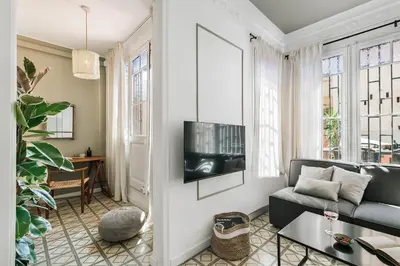 a bathroom with a shower and a toilet and a sink at Oltre - 3 bedrooms in Eixample Esquerra in Barcelona