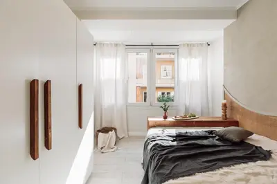 a bedroom with a bed and a mirror at Ona - 2 bedrooms in Sant Gervasi in Barcelona
