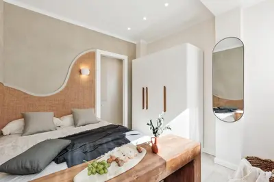a white bathroom with a toilet and a glass shower at Ona - 2 bedrooms in Sant Gervasi in Barcelona