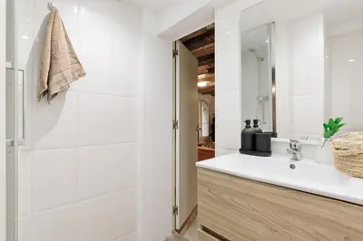 a living room with a couch and a tv at Sitges - 2 bedrooms in St Pere Sta Caterina i Ribera in Barcelona