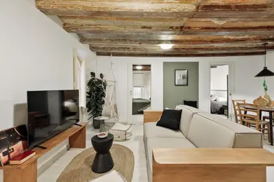 a kitchen and dining room with a table and chairs at Sitges - 2 bedrooms in St Pere Sta Caterina i Ribera in Barcelona