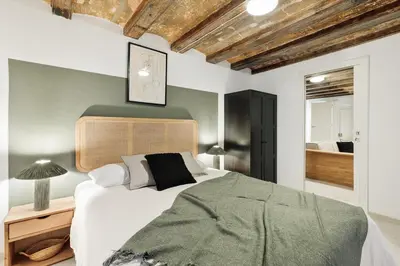a living room with a couch and a tv at Sitges - 2 bedrooms in St Pere Sta Caterina i Ribera in Barcelona