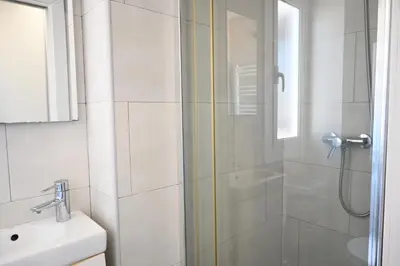 a bathroom with a shower and a sink at Homenfun Barcelona Ciutat Vella in Barcelona