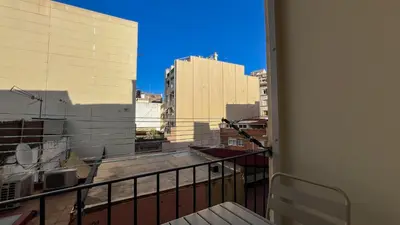 a balcony with a view of a city skyline at 