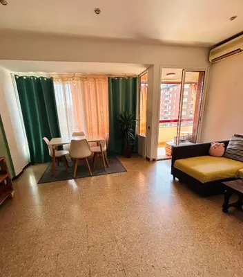 a living room with a couch and a table at Alojamiento,Les corts in Barcelona