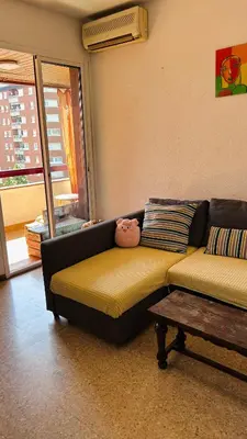 a living room with a couch and a table at Alojamiento,Les corts in Barcelona