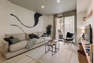 a mirror in a white room with candles on a shelf at Hebron - 2 bedrooms and office in Gràcia in Barcelona