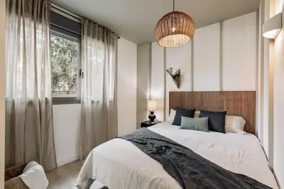 a white bathroom with a sink and a shower at Hebron - 2 bedrooms and office in Gràcia in Barcelona