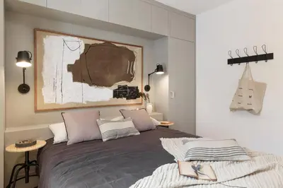 a bedroom with a large bed and a mirror at Torla - 3 bedrooms and terrace in Sant Gervasi in Barcelona