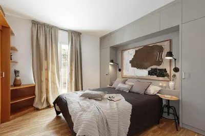 an outdoor patio with a couch and chairs and tables at Torla - 3 bedrooms and terrace in Sant Gervasi in Barcelona