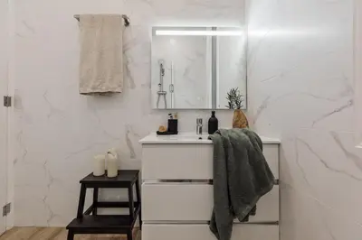 a white bathroom with a toilet and a sink at Takalik - 4 bedrooms and office in l'Eixample Esq. in Barcelona
