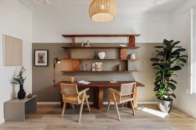 a home office with a wooden desk and wooden shelves at Takalik - 4 bedrooms and office in l'Eixample Esq. in Barcelona