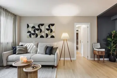 a bedroom with a bed and a desk and a table at Paul - 2 bedrooms and pool in Poblenou in Barcelona