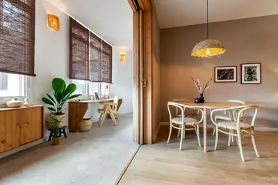 a dining room with a table and chairs at Padar - 2 bedrooms in Eixample Dreta in Barcelona