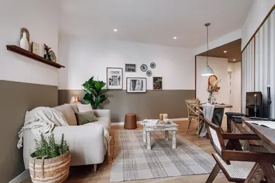 a living room with a couch and a table at Montoro - 1 bedroom in Eixample Esquerra in Barcelona