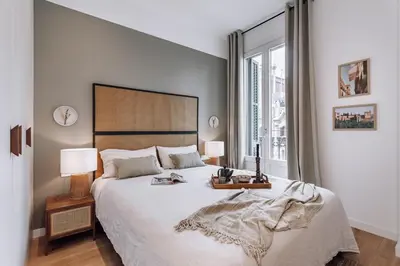 a living room with a table and a couch at Montoro - 1 bedroom in Eixample Esquerra in Barcelona