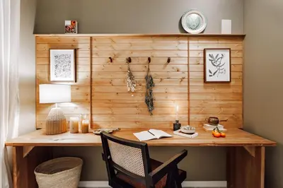 a wooden wall with a desk with a chair at Aldeire - 2 bedrooms, office in Eixample Esquerra in Barcelona