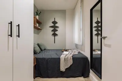 a room with a table and a chair at Chulamar - 2 bedrooms and balcony in Sant Gervasi in Barcelona