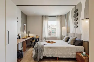 a living room with a couch and a table at Chulamar - 2 bedrooms and balcony in Sant Gervasi in Barcelona