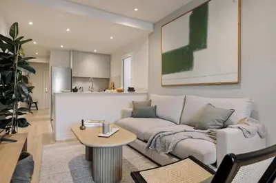a living room with a couch and a table at Chulamar - 2 bedrooms and balcony in Sant Gervasi in Barcelona