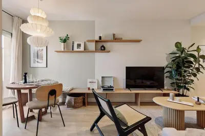 a living room with a couch and a table at Chulamar - 2 bedrooms and balcony in Sant Gervasi in Barcelona