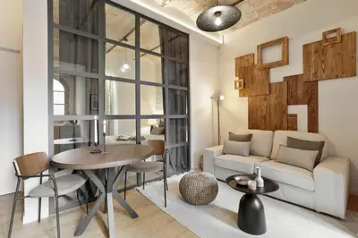 a bedroom with a large bed with a table on it at Aleu - 2 bedrooms and balcony in Sagrada Família in Barcelona