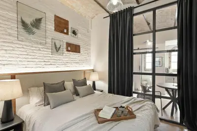 a living room with a couch and a table at Aleu - 2 bedrooms and balcony in Sagrada Família in Barcelona