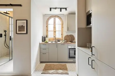 a bathroom with a toilet and a sink and a mirror at Aleu - 2 bedrooms and balcony in Sagrada Família in Barcelona