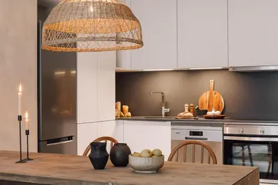 a table and chairs in a room with a black wall at Nivar - 2 bedrooms in Eixample Esquerra in Barcelona