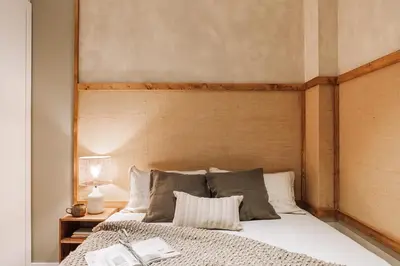 a bedroom with a bed with a window and a mirror at Nivar - 2 bedrooms in Eixample Esquerra in Barcelona