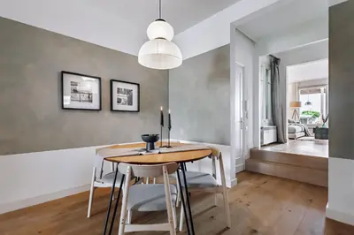a bedroom with a large bed and white walls at Aribe - 3 bedroom and terrace in Eixample Esquerra in Barcelona