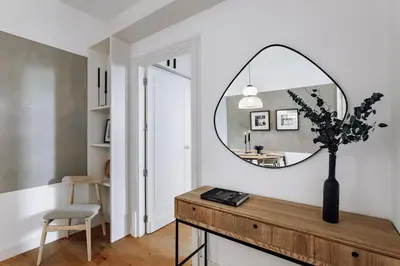 a bedroom with a large bed and a window at Aribe - 3 bedroom and terrace in Eixample Esquerra in Barcelona