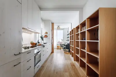 a bedroom with a bed and a desk and two windows at Aribe - 3 bedroom and terrace in Eixample Esquerra in Barcelona