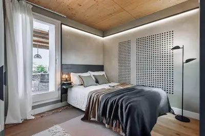 a patio with a couch and chairs on a roof at Aribe - 3 bedroom and terrace in Eixample Esquerra in Barcelona