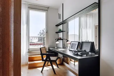 a bedroom with a large bed and white walls at Aribe - 3 bedroom and terrace in Eixample Esquerra in Barcelona