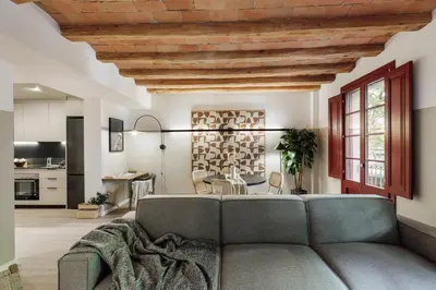 a room with a floor lamp and a table and chairs at Cadaques - 1 bedroom and balcony in Sant Antoni in Barcelona