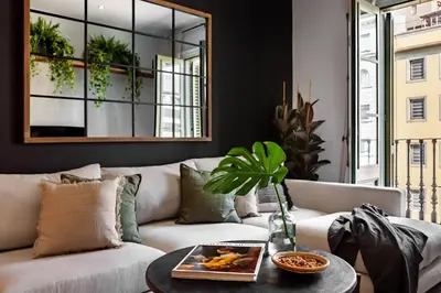 a dining room with a table and chairs at Quena - 2 bedrooms and balcony in Eixample Dreta in Barcelona