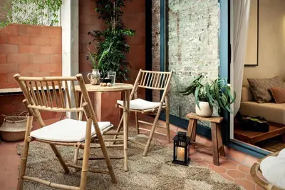 two chairs and a table on a patio at Akita - 2 bedrooms, terrace in Eixample Esquerra in Barcelona
