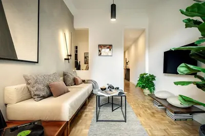 a living room with a couch and a table at Akita - 2 bedrooms, terrace in Eixample Esquerra in Barcelona
