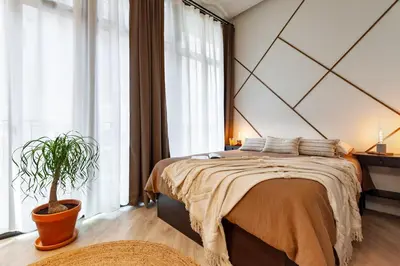 a bedroom with a bed and a large window at Siwa - 2 bedrooms in Eixample Dreta in Barcelona