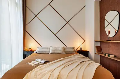 a bedroom with a large bed and a mirror at Siwa - 2 bedrooms in Eixample Dreta in Barcelona