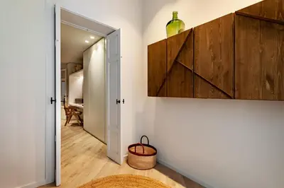 a hallway with a door leading to a room at Siwa - 2 bedrooms in Eixample Dreta in Barcelona