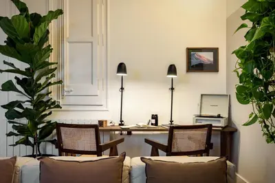 a white vase sitting on top of a wooden table at Fuji - 2 bedrooms and terrace in Eixample Esquerra in Barcelona