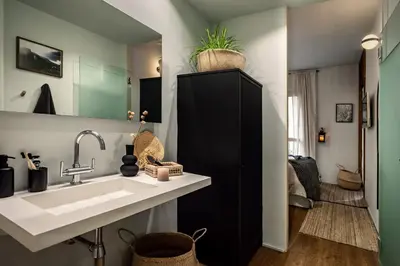 a mirror in a bedroom with a bed and a tv at Shokai - 1 bedroom in Ciutat Vella in Barcelona