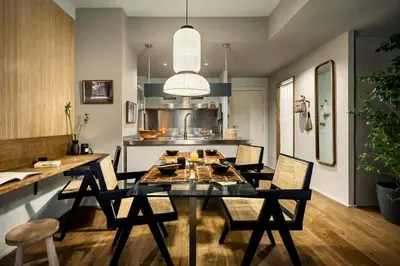 a dining room with a table with chairs and a lamp at Shokai - 1 bedroom in Ciutat Vella in Barcelona