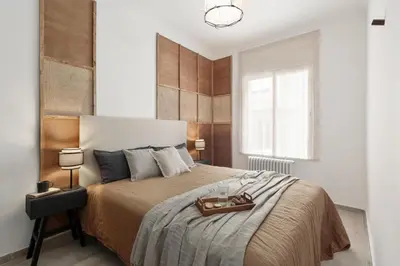 a living room with a table and a window at NIVE - 3 bedrooms apartment in Sant Gervasi in Barcelona